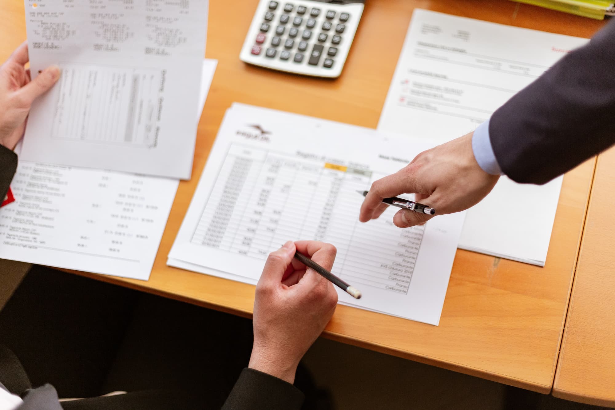 two people reviewing financial documents