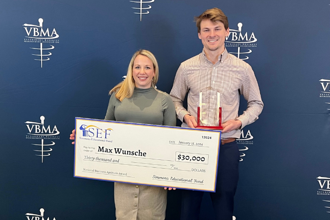 Simmons & Associate's Carly Watson Tobler presents a $30,000 check to 2024 SEF Business Aptitude Award Winner Max Wunsche.